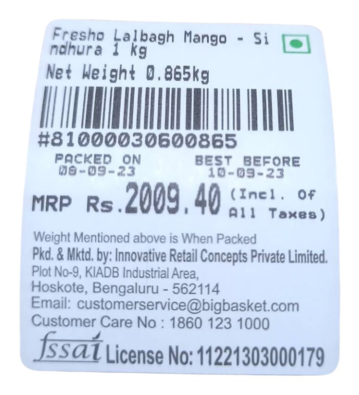 A printed thermal traceability label showing product name, net weight, barcode, packed-on and best-before dates, MRP and FSSAI licence number